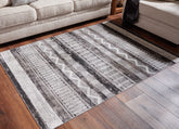 Bay Furniture Gallery - Ashley Furniture - Henchester Rug - 5' x 7' Washable Rug / Multi - R405992